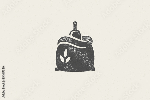 Silhouette sack of wheat flour with scoop designed for grain farm industry hand drawn stamp effect vector illustration.