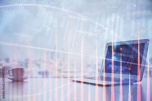 Forex graph hologram on table with computer background. Multi exposure. Concept of financial markets.