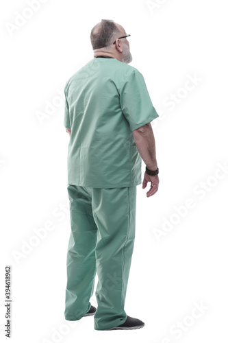 side view. Mature doctor looking at copy-space.