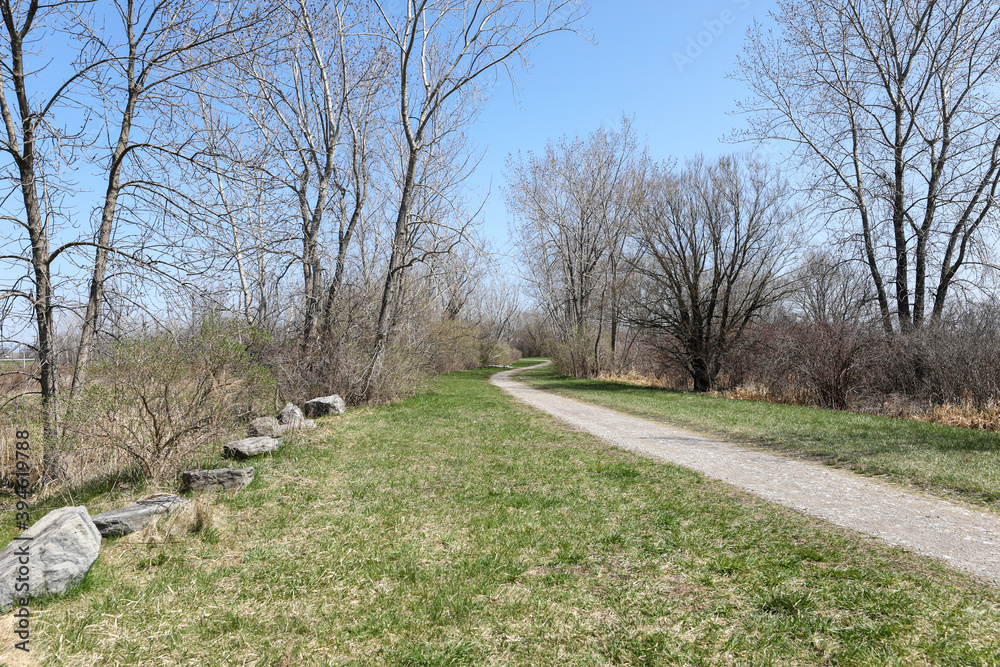 Hiking trail through Beatty Point Park in the early spring. Braddock Bay Wildlife Management area in the town of Greece, New York. Hiking trail through Beatty Point Park in the early spring. Braddock Bay Wildlife Management area in the town of Greece, New York.
