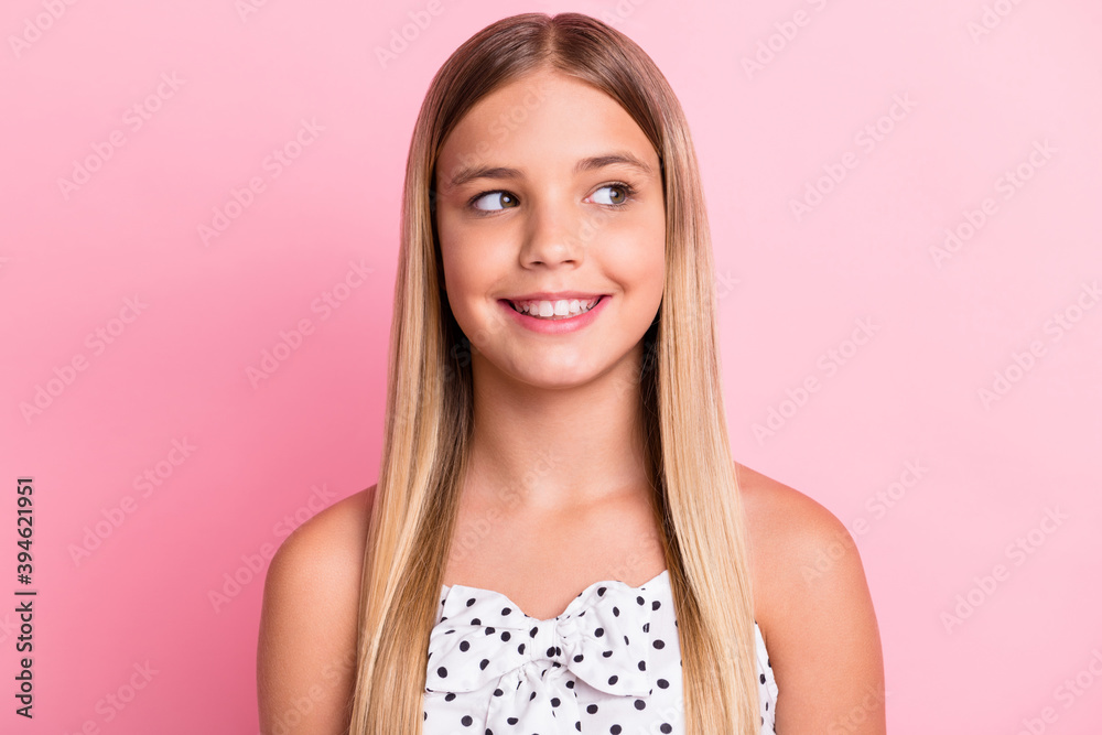 Portrait of sweet optimistic blond girl look empty space wear white cloth isolated on pastel pink color background Portrait of sweet optimistic blond girl look empty space wear white cloth isolated on pastel pink color background