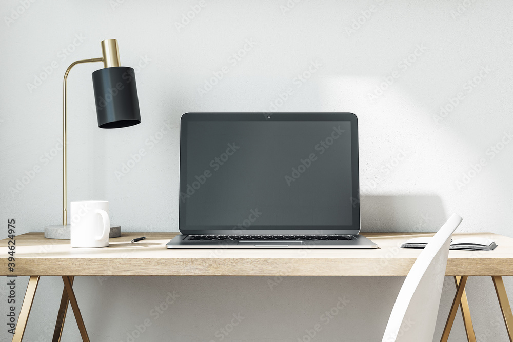 Comfortable workplace with laptop on table in home office. Comfortable workplace with laptop on table in home office.