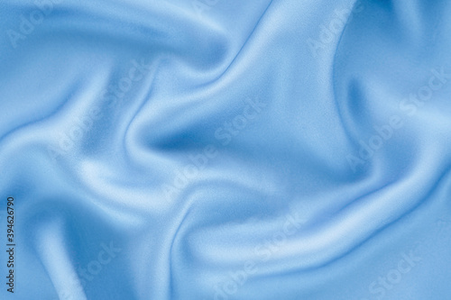 Elegant light blue silk background.