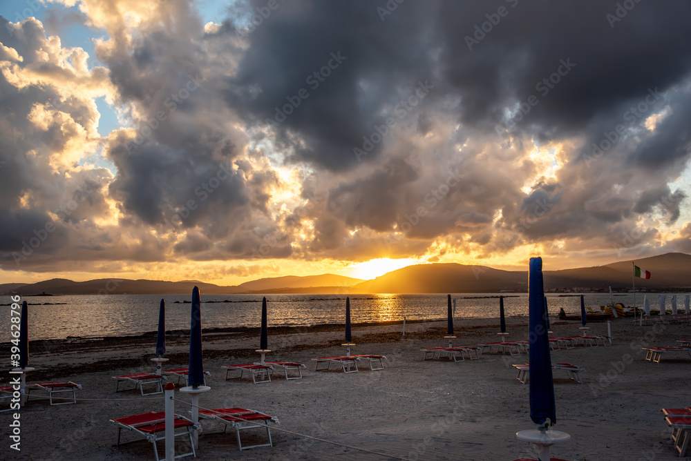 Dark clouds over Alghero coast at sunset Dark clouds over Alghero coast at sunset