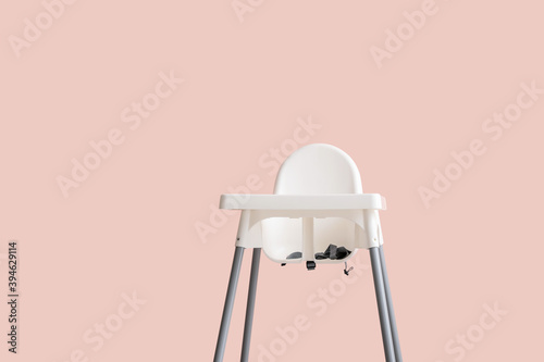 Baby highchair on color background photo