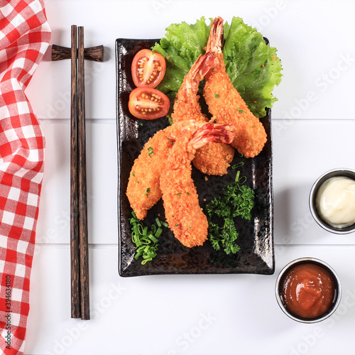 Tempura Shrimp/Prawn, Japanese Traditional Cuisine made from Deep Fried Shrimp  Coated with Bread Crumb or Panko, Usually Find as Bento Lunch Menu. On White Wooden Background photo