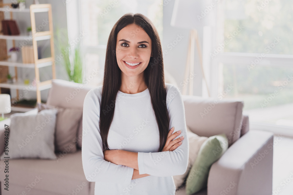 Photo of beautiful relaxed pretty young woman crossed hands weekend rest inside house living room indoors Photo of beautiful relaxed pretty young woman crossed hands weekend rest inside house living room indoors