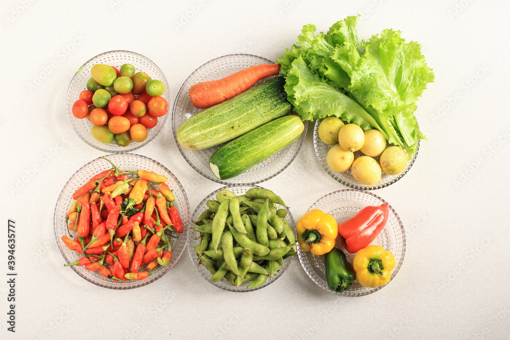.Flatlay Composition of Fresh Vegetable on Clear Plate Above Cream Table. Vibrance Color Pleasing Eye. Concept of Dieting . .Flatlay Composition of Fresh Vegetable on Clear Plate Above Cream Table. Vibrance Color Pleasing Eye. Concept of Dieting .
