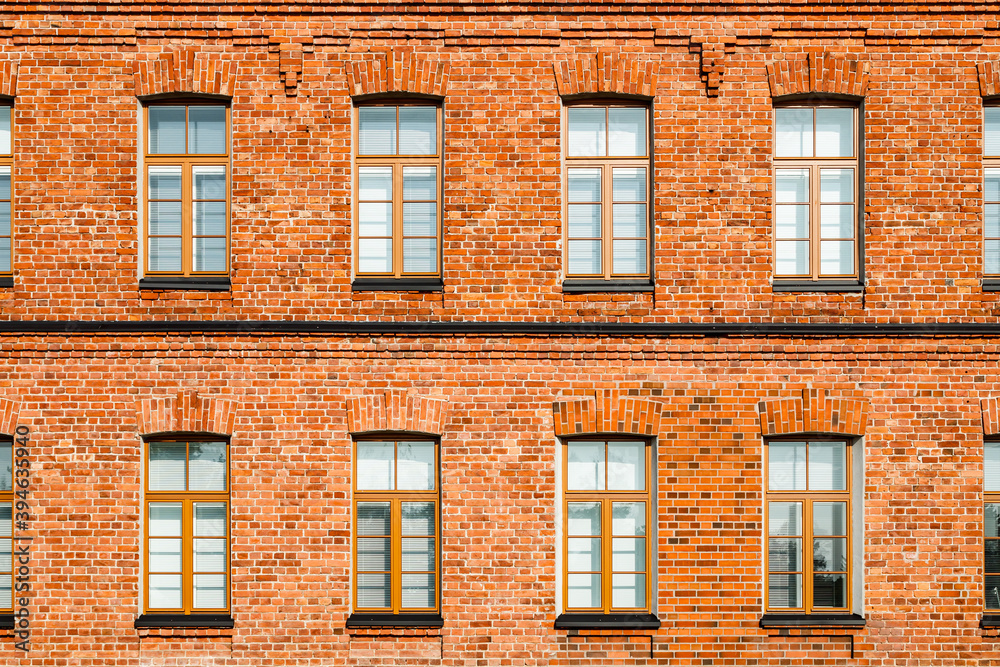 Fototapeta premium Beautiful vintage red brick building at sunny day
