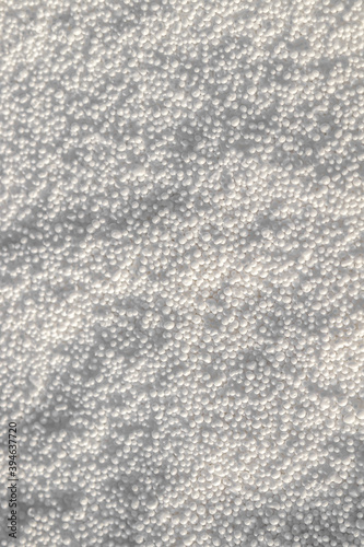 Ammonium nitrate granules as background.