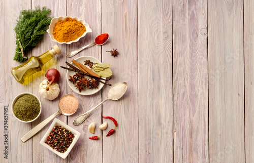A variety of spices on a wooden table
