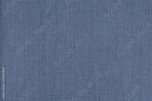 Texture of rough natural linen fabric in blue color. Natural coarse burlap, nice blue color.