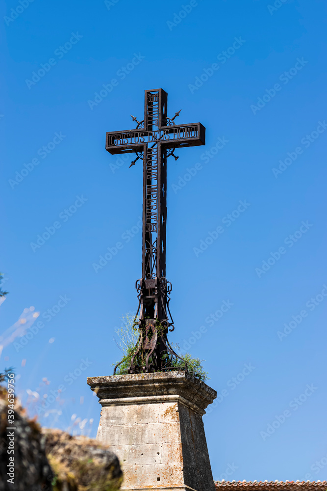 Detail of the Christian cross of the Ermita de San Frutos, with inscriptions in Latin. Photograph taken in Burgomillodo, Segovia, Spain.