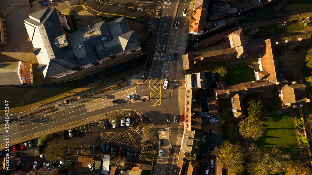 Over head shot looking down at cars crossing a junction