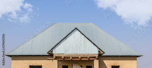 Wallpaper Mural The roof of the house is made of galvanized metal profile against the sky Torontodigital.ca