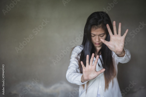 Woman bondage in angle of abandoned building , Stop violence and sexual abuse towards women, international women's day