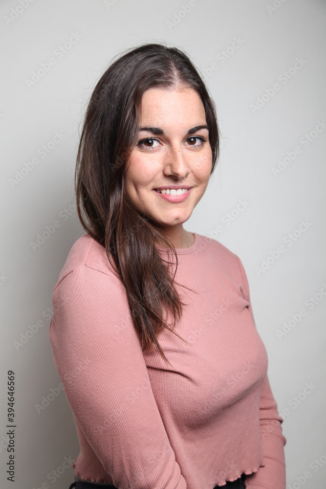 Beautiful young woman portrait, Studio shot isolated on grey background Beautiful young woman portrait, Studio shot isolated on grey background