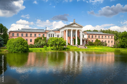 Main Botanical Garden Of The Moscow. Classical building with columns reflecting in Botanical Pond