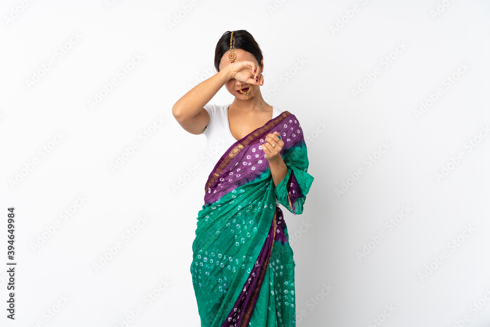 Young indian woman isolated on white background covering eyes by hands