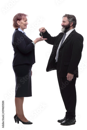 businessman handing keys to a business lady . isolated on a white
