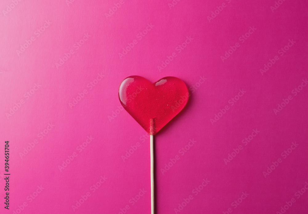 pink lollipop heart on pink background pink lollipop heart on pink background