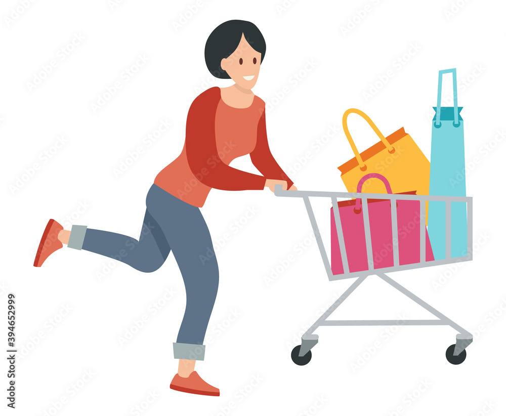 Woman with bags for purchases in the shopping cart. Young beautiful fashion shopper girl isolated on white background. Sale advertising. Female character running after the vehicle in the store Woman with bags for purchases in the shopping cart. Young beautiful fashion shopper girl isolated on white background. Sale advertising. Female character running after the vehicle in the store