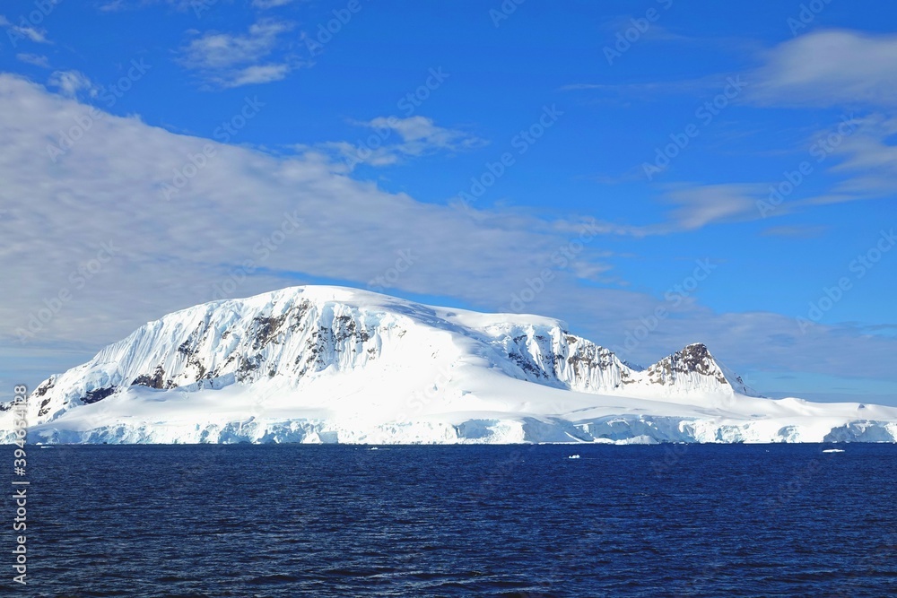 custom made wallpaper toronto digitalAntarctic iceberg under blue sky.