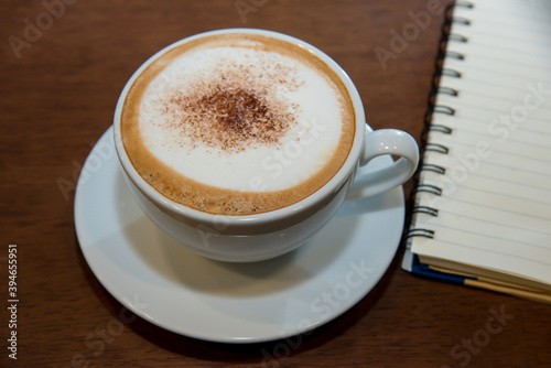 cup of coffee on wooden table