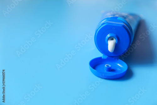 Close up of face cream in a container on blue background 