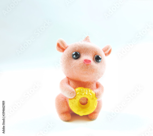  funny toy figurine pet with donut in hands 
