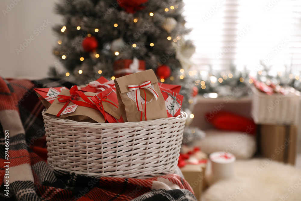 Basket full of gifts in paper bags for Christmas advent calendar at home, space for text Basket full of gifts in paper bags for Christmas advent calendar at home, space for text