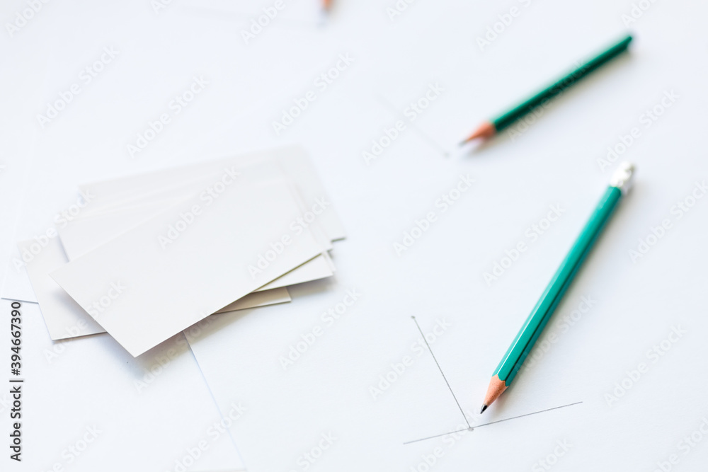 blank business cards and a white sheet of paper containing blank business cards and a white sheet of paper containing