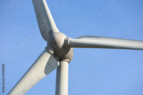close up of a wind power plant in fine weather and blue sky
