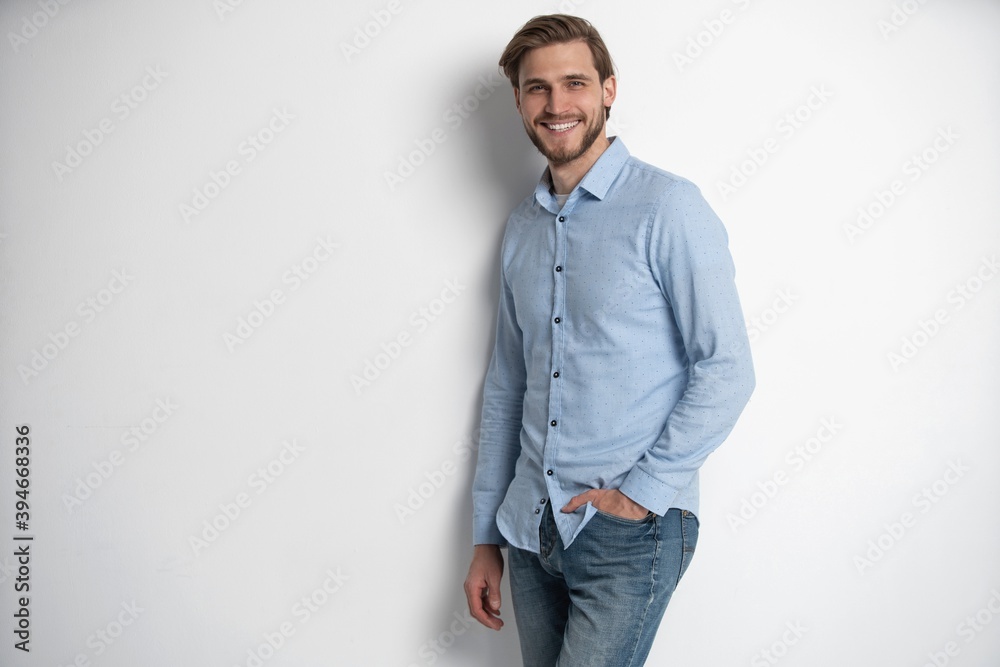Portrait of a smart young man standing against white background. Portrait of a smart young man standing against white background.