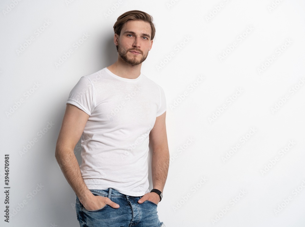 Portrait of a smart young man standing against white background. Portrait of a smart young man standing against white background.