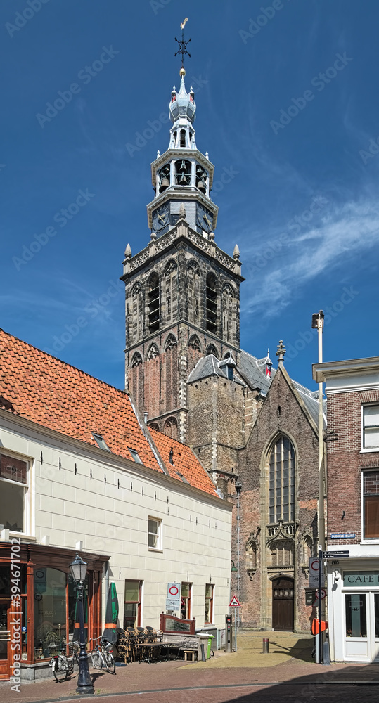 Tower and fragment of facade of Sint Janskerk (St John the Baptist Church) in Gouda, Netherlands. The church was built during the 15th and 16th centuries.