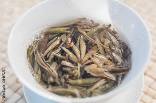 Bai Hao Yin Zhen  White Hair Silver Needle  white tea leaves steeping in a gaiwan Zhong  Gong Fu Cha brewing. Beautiful full bud leaves perfectly processed.