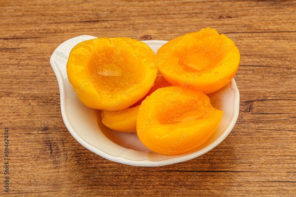 Marinated peaches fruit in the bowl