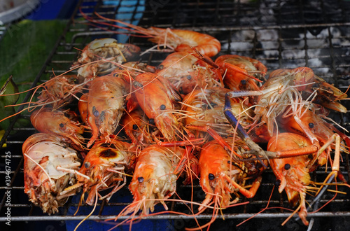 Grill time grill seafood snacks a charcoal shrimps street food traditional at Thailand