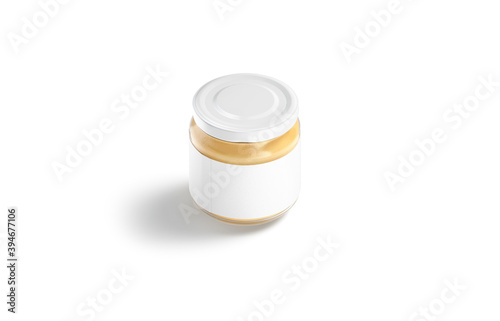 Blank small glass jar with label and peanut butter mockup photo