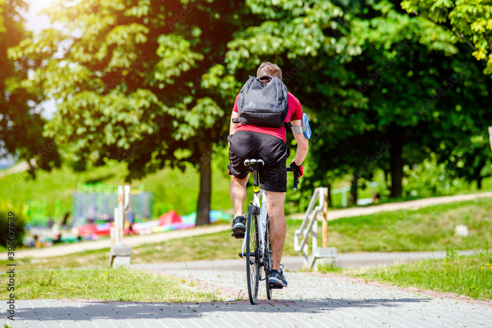 Fototapeta premium Cyclist ride on the bike path in the city Park 