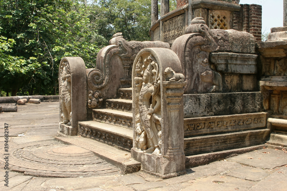 Polonnaruwa Sri Lanka Ancient ruins Statues at entrance to shrine beside stairs
