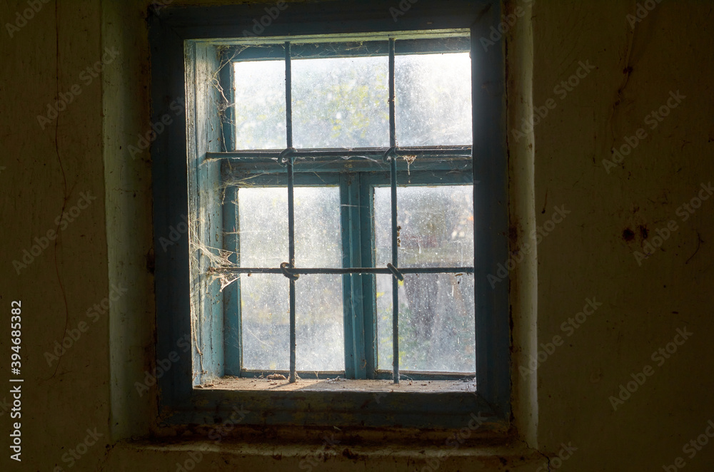 Light in the window in an old clay house