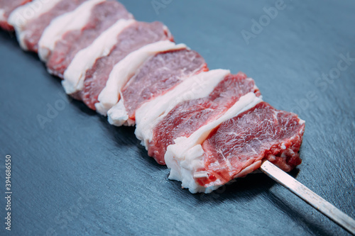 Skewers of fresh and raw shish kebab or barbecued shashlik meat. 