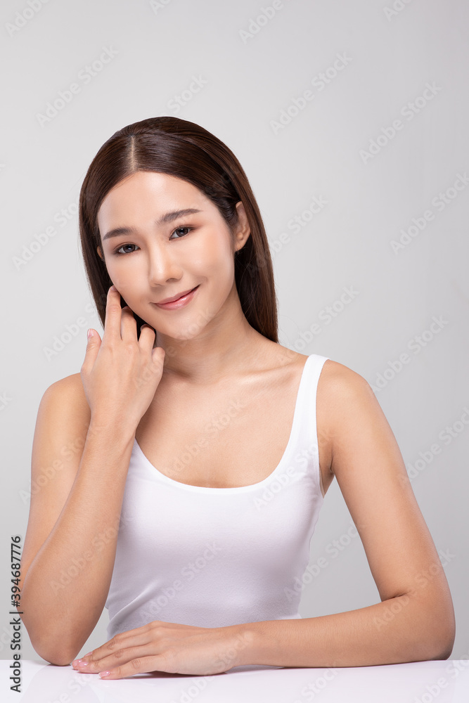 Beautiful Asian young woman touching soft cheek smile with clean and fresh skin Happiness and cheerful with positive emotional,isolated on gray background,Beauty and Cosmetics Concept Beautiful Asian young woman touching soft cheek smile with clean and fresh skin Happiness and cheerful with positive emotional,isolated on gray background,Beauty and Cosmetics Concept
