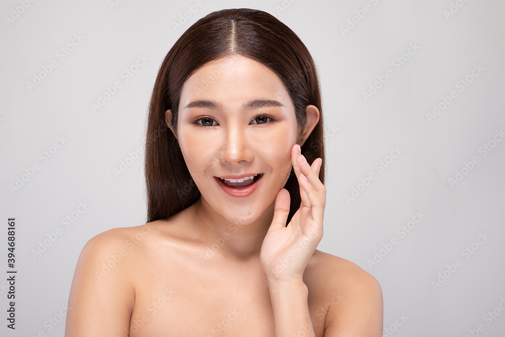 Beautiful Asian young woman touching soft cheek smile with clean and fresh skin Happiness and cheerful with positive emotional,isolated on gray background,Beauty and Cosmetics Concept Beautiful Asian young woman touching soft cheek smile with clean and fresh skin Happiness and cheerful with positive emotional,isolated on gray background,Beauty and Cosmetics Concept