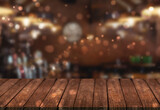 bar interior con efecto glow, mesa de madera en color marrón imagen desenfocada 3