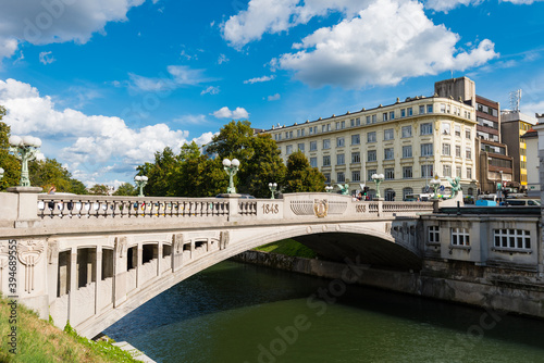 The dragon bridge over the Ljubljanica river in Ljubljana on sunny day photo