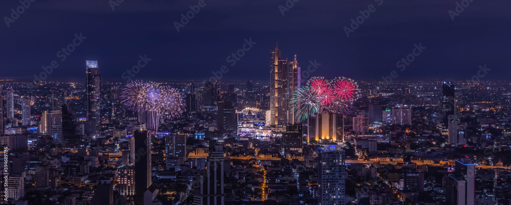 Fototapeta premium Panorama view of Beautiful fireworks over city of Bangkok, Thailand