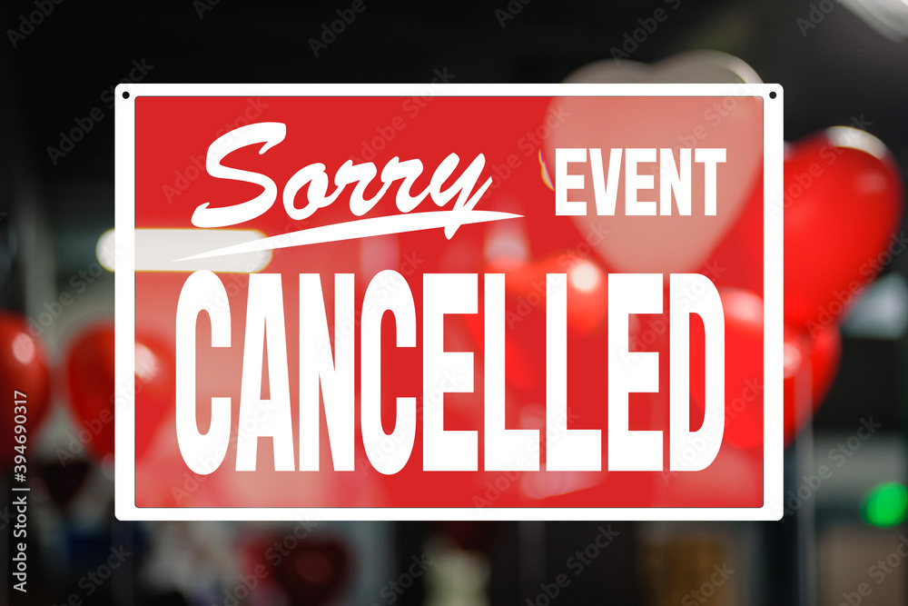 Big red cancelled sign covers decorated room for St Valentine's Day celebration, precautions during a pandemic, combating covid virus, social distancing Big red cancelled sign covers decorated room for St Valentine's Day celebration, precautions during a pandemic, combating covid virus, social distancing